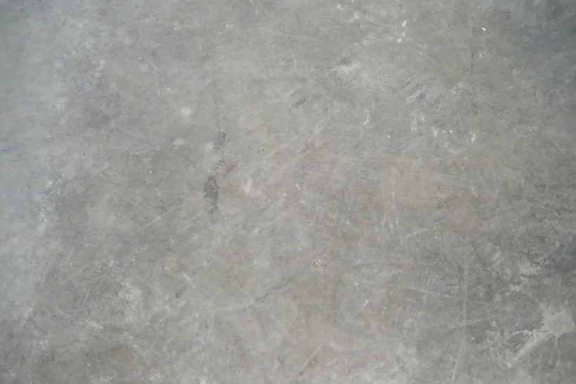 Cracked, stained concrete garage floor before epoxy coating in Kellyville